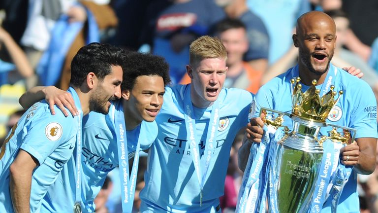 Ilkay Gundogan, Leroy Sane, Kevin De Bruyne and Vincent Kompany celebrate winning the Premier League in 2018