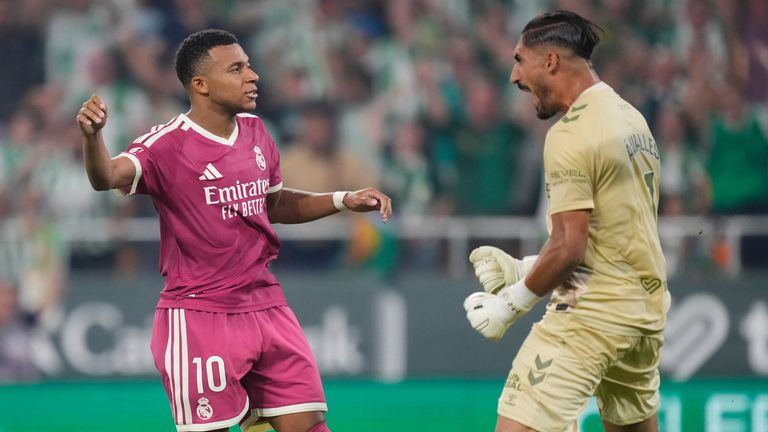 Real Madrid's Kylian Mbappe, left, reacts after missing a penalty kick 