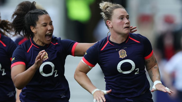 Megan Jones of England celebrates scoring her teams third tr