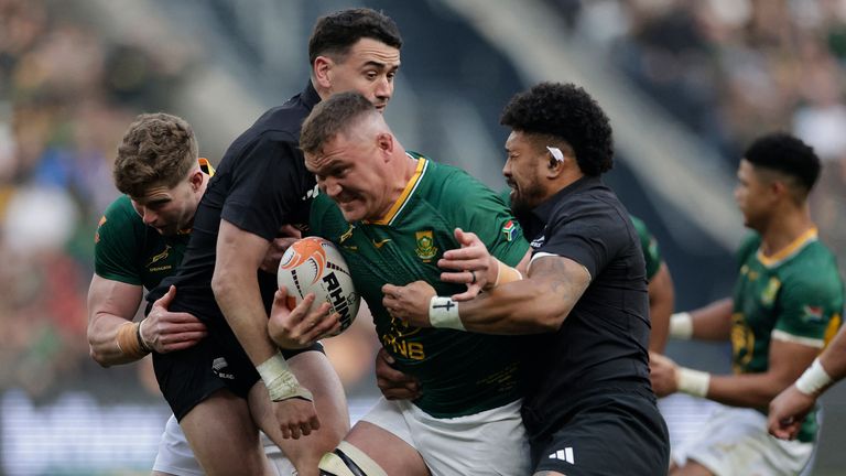 New Zealand's Ardie Savea tackles South Africa's Jasper Wiese during the third Rugby's Greatest Rivalry match