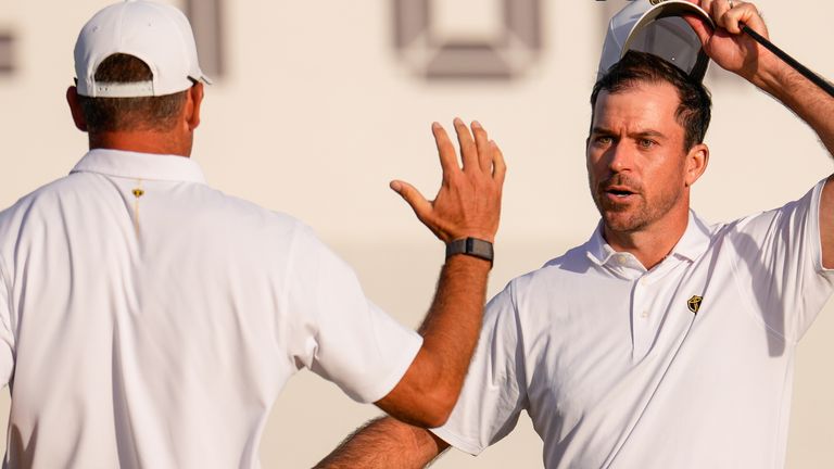 International teams' Nick Taylor, of Canada, right, celebrates with Corey Conners, of Canada, after their Presidents Cup