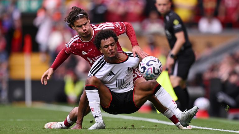 Oscar Bobb of Fulham is challenged by Milos Kerkez of Liverpool