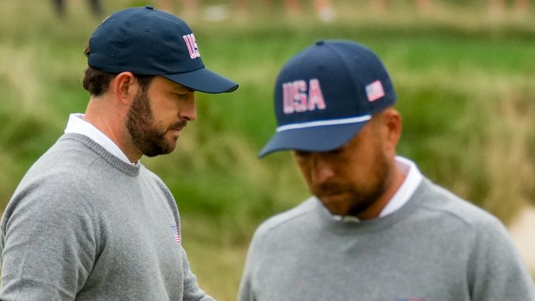 Patrick Cantlay and Xander Schauffele walk of the first green after losing the hole to the International team during the Presidents Cup