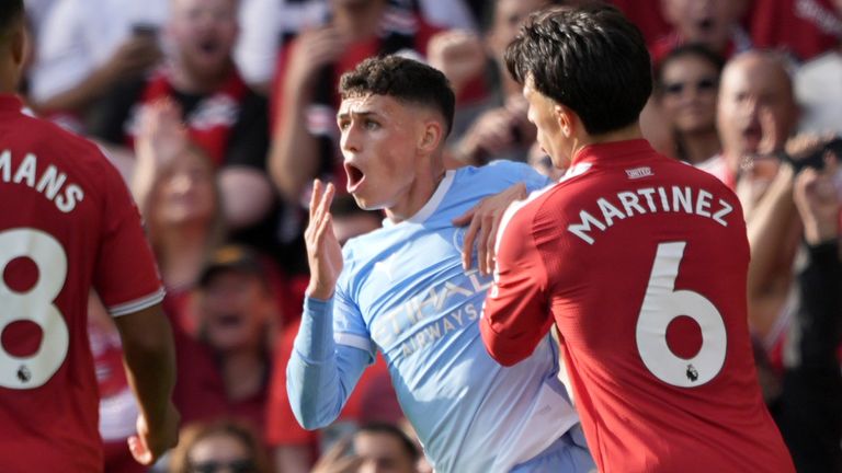 Phil Foden reacts after being shown a red card for kicking out at Bruno Fernandes