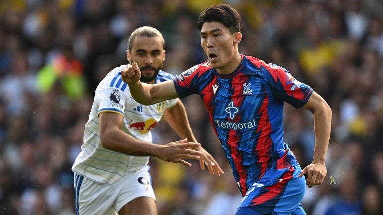 Takehiro Tomiyasu is closed down by Dominic Calvert-Lewin
