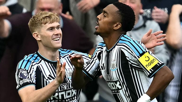 Goalscorers Lewis Hall and Joe Willock celebrate at St James' Park