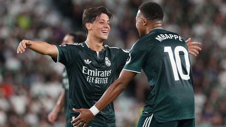 Real Madrid's Arda Guler, left, celebrates with Real Madrid's Kylian Mbappe after scoring his sides first goal during the Spanish La Liga soccer match between Elche and Real Madrid in Elche, Spain, Tuesday, Sept. 15, 2026. (AP Photo/Alberto Saiz)