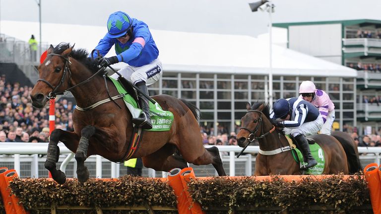 Hurricane Fly ridden by Ruby Walsh jumps the last fence and goes on to win the Stan James Champion Hurdle Challenge Trophy