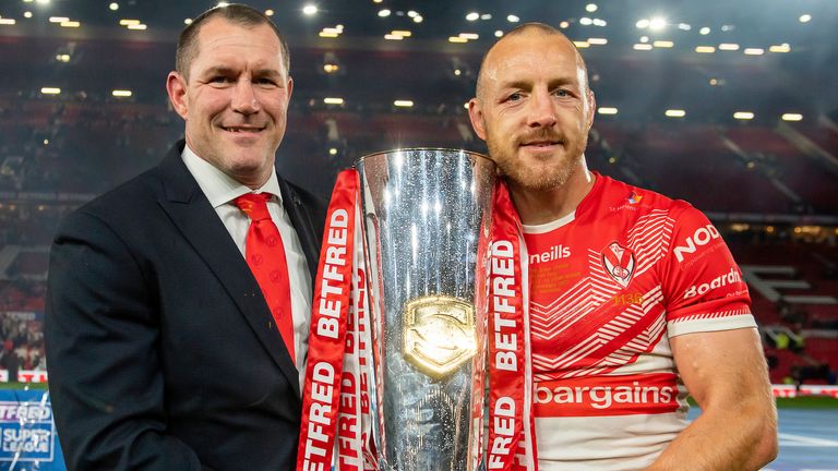 Picture by Allan McKenzie/SWpix.com - 24/09/2022 - Rugby League - Betfred Super League Grand Final - St Helens v Leeds Rhinos - Old Trafford, Manchester, England -St Helens coach and captain Kristian Woolf & James Roby with the Betfred Super League trophy.