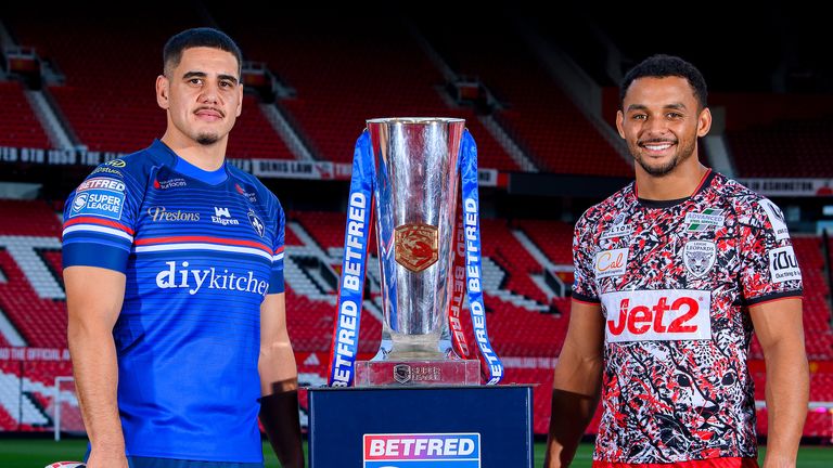 Picture by Allan McKenzie/SWpix.com - 14/09/2026 - Rugby League - Betfred Super League Playoffs Launch - Old Trafford, Manchester, England - Wakefield's Caleb Hamlin-Uele with Leigh's Umyla Hanley and the Betfred Super League trophy.