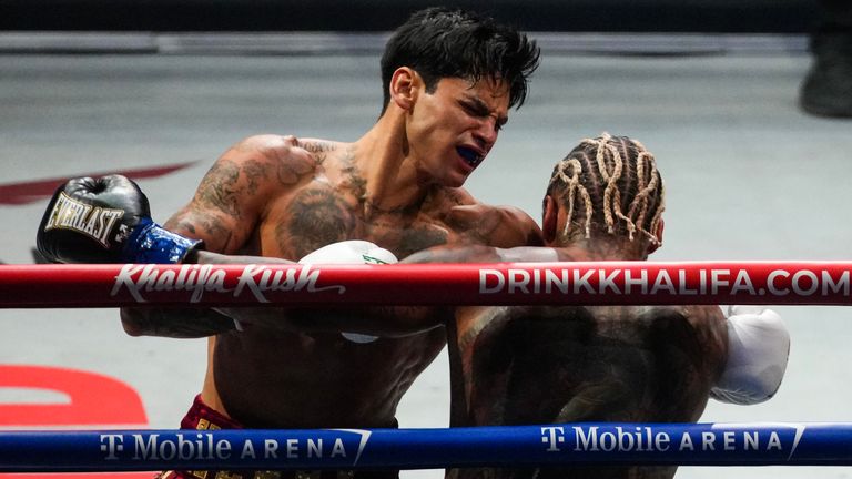 Garcia traps Benn on the ropes.