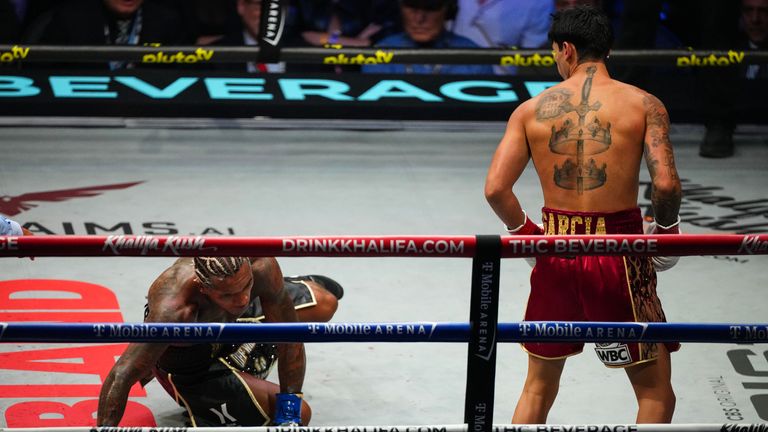 Garcia drops Benn heavily in the second round.
