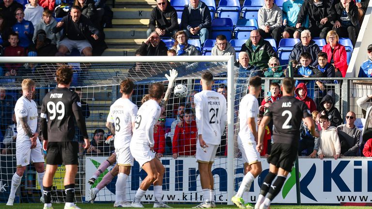 St Johnstone's Enes Alic (R) scores a free-kick to make it 1-1 against Falkirk