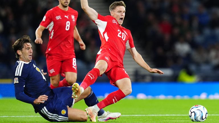 Scotland's Luis Binks challenges Switzerland's Michel Aebischer 