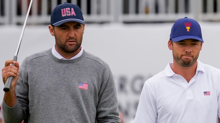 USA teams' Scottie Scheffler, left, and Sam Burns look at the seventh green after Burns missed his putt against the International team