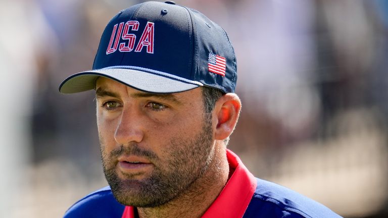 USA teams' Scottie Scheffler walks up the 12th fairway during a Presidents Cup golf 
