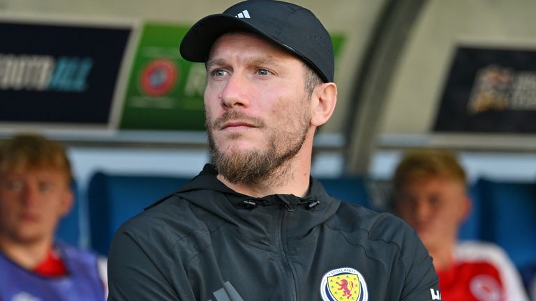 Scotland head coach Sebastien Pocognoli stands on the touchline before the match 