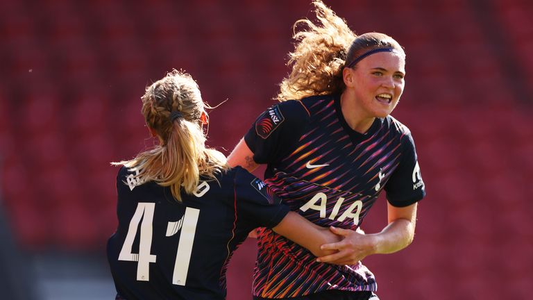 Signe Gaupset and Julie Blakstad of Tottenham Hotspur celebrate their team's first goal, an own goal scored by Samantha Kerr of Liverpool