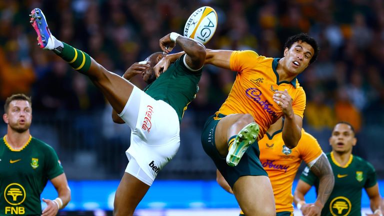 South Africa's Aphelele Fassi, left, and Australia's Joseph-Aukuso Suaalii compete for a high ball (AP Photo/Gary Day)
