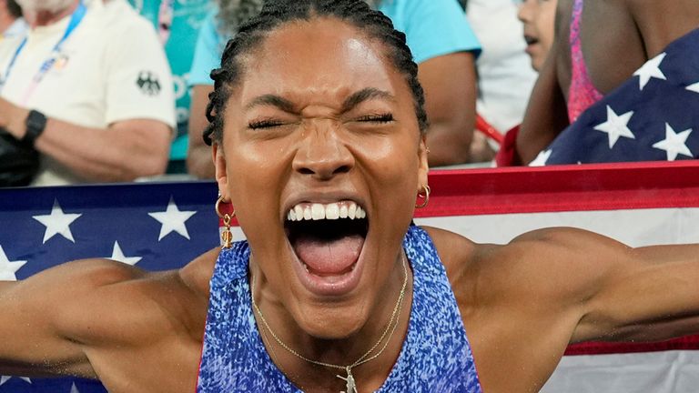 Davis-Woodhall celebrates after winning the women's long jump final at the 2024 Summer Olympics