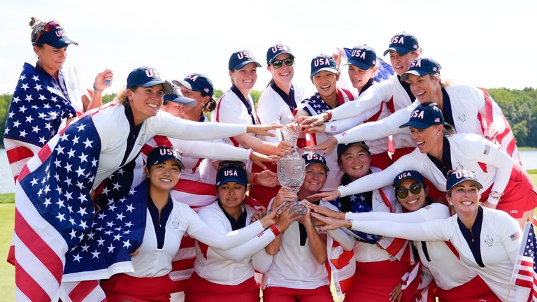 United States players poses for photographs after the United States won the Solheim Cup golf tournament against Europe 