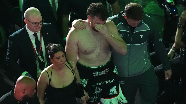 Carty walks away from the ring in tears