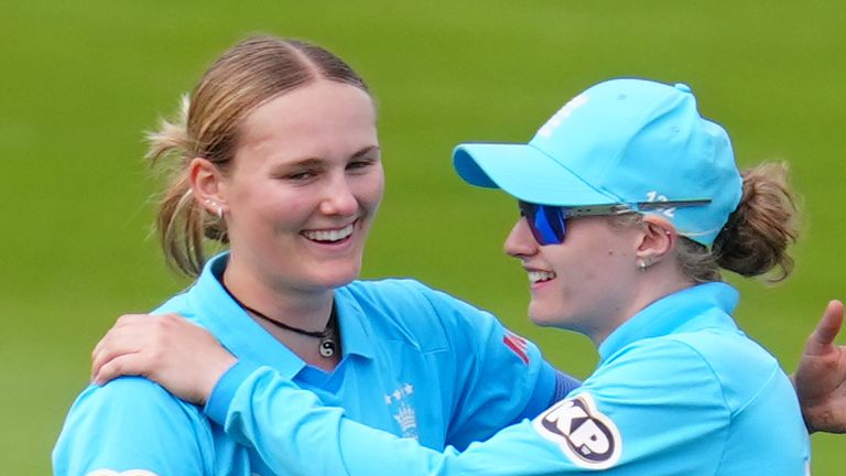 England spinner Tilly Corteen-Coleman celebrates with captain Charlie Dean during the third ODI against Ireland