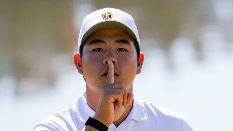 International teams' Tom Kim, of South Korea, reacts after his shot on the 12th green against the USA team during a Presidents Cup