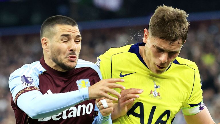Aston Villa's Emi Buendia (left) and Tottenham Hotspur's Micky van de Ven battle for the ball during the Premier League match at Villa Park,