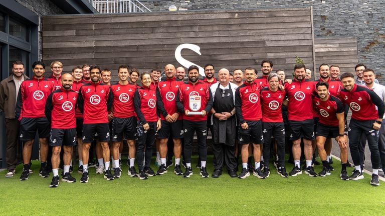 Vitor Matos poses with his Swansea City staff after winning the Sky Bet Championship Manager of the Month award for August