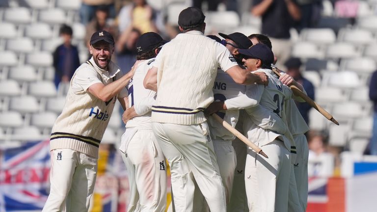Warwickshire players celebrate after beating Leicestershire by an innings and win the Rothesay County Championship Division One, during day 