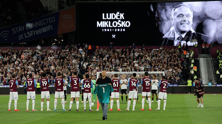 Tomas Soucek carries a shirt to be laid behind a goal in tribute to former West Ham United player, Ludek Miklosko