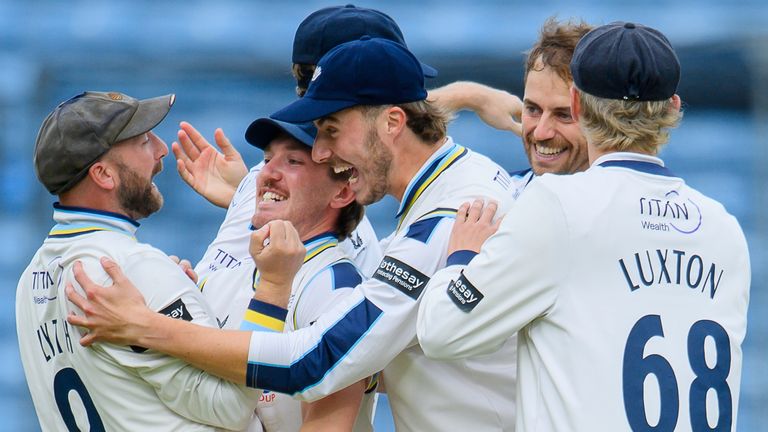 Yorkshire players congratulate Adam Lyth (l) for taking a catch from the bowling of Ben Coad to dismiss Somerset's James Rew (SWpix.com)