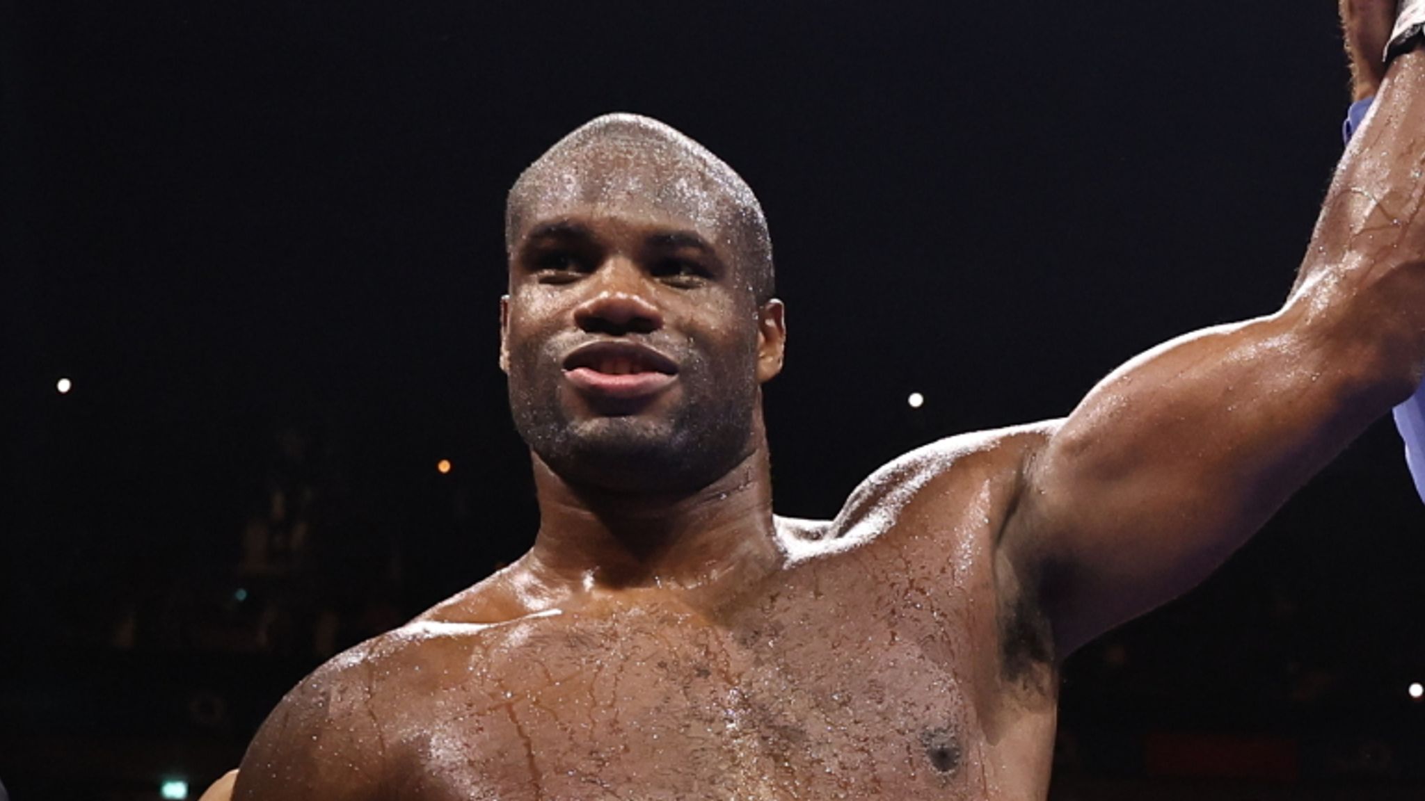 Dubois has his hand raised in victory. (Photos: Leigh Dawney/Queensberry Promotions)