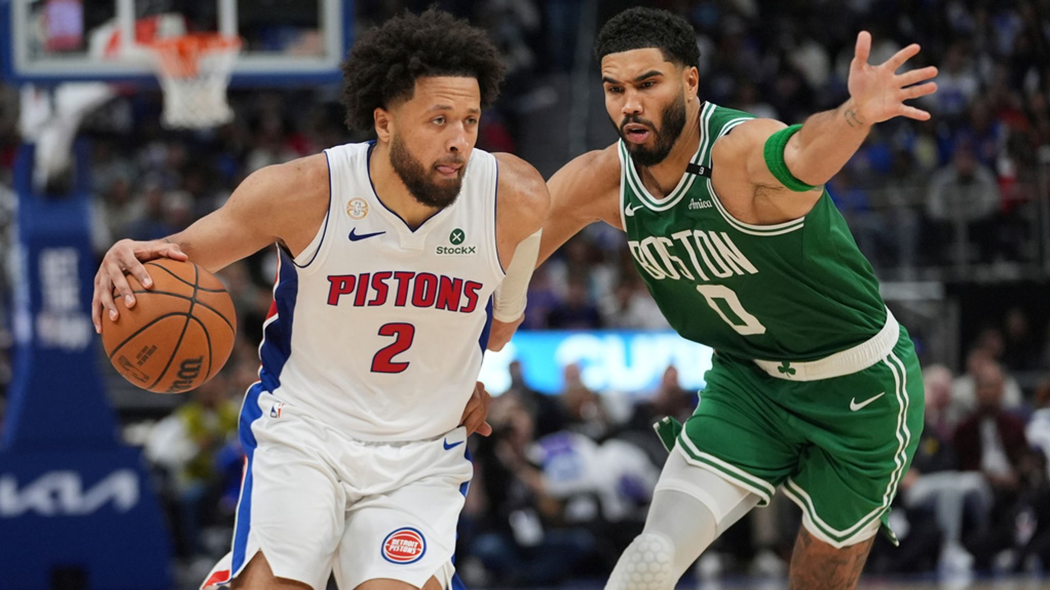 Detroit Pistons guard Cade Cunningham (2) drives on Boston Celtics forward Jayson Tatum (0) in the NBA season tip off