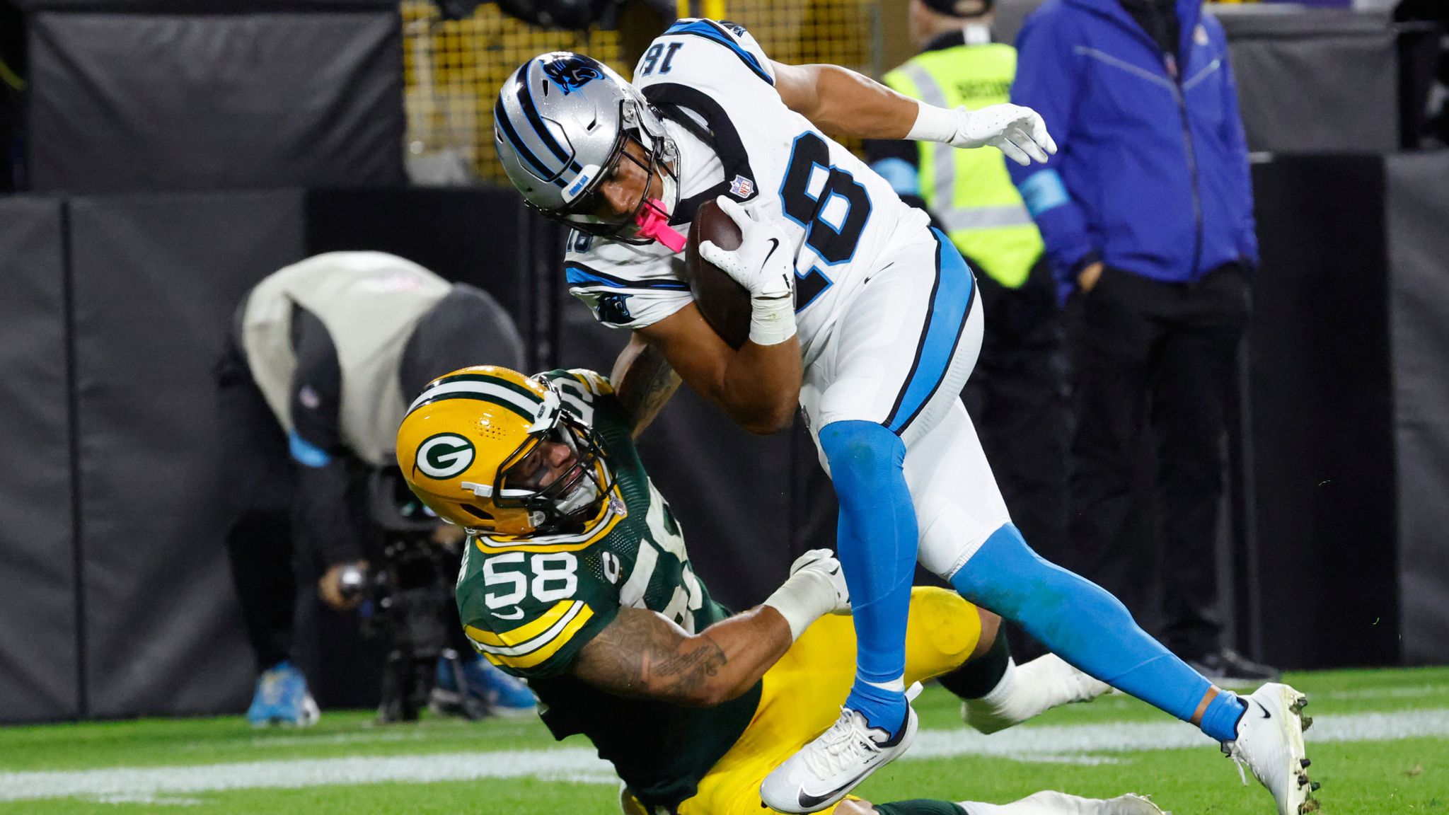 Image: Carolina Panthers wide receiver Coker (18) scores a touchdown over Green Bay Packers linebacker McDuffie