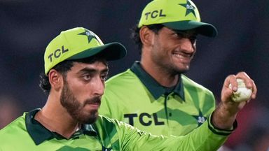 Pakistan's players clap for teammate Arafat Minhas, center, who took the six wickets
 