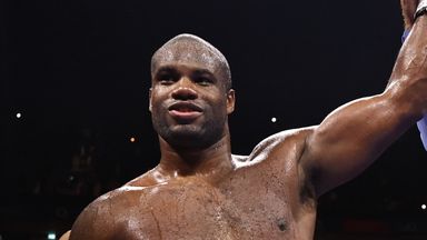 Dubois has his hand raised in victory
