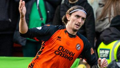 Dundee United's Daniel Bennie celebrates as he scores to make it 1-0 against Hibs