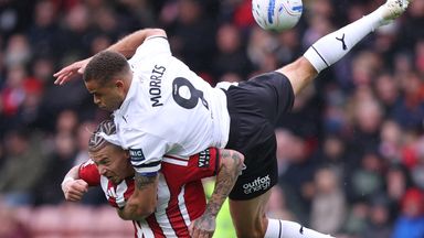 Kalvin Phillips of Sheffield United battles for possession with Carlton Morris of Derby County