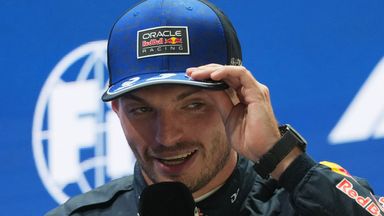 Red Bull driver Max Verstappen of the Netherlands speaks after finishing first in the sprint qualifying session ahead of the Singapore Formula One Grand Prix in Singapore, Friday, Oct. 9, 2026. (AP Photo/Ng Han Guan)