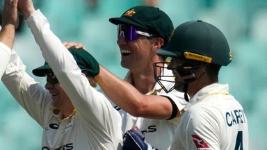 Australia's Steven Smith, second left, celebrates with his teammates after taking a catch on day three
