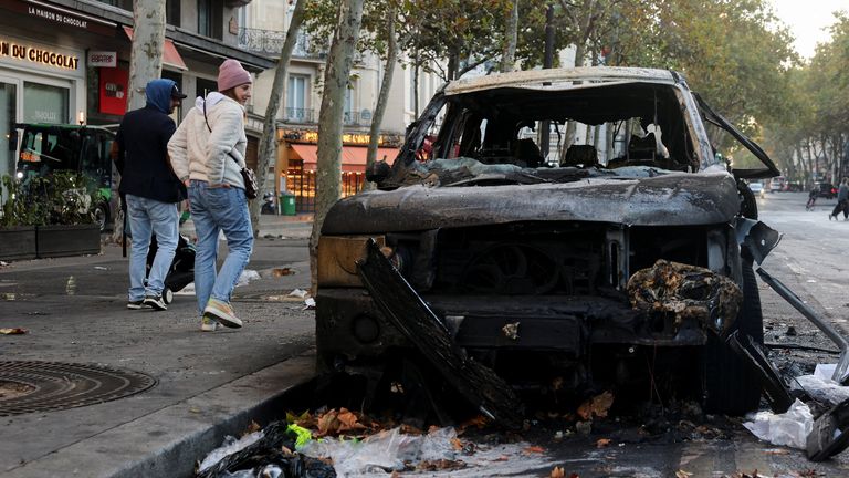 Burnt car on street in Paris. Pic: Reuters