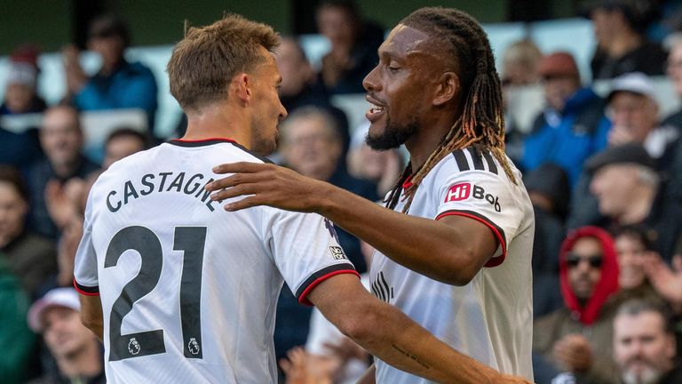 Goalscorer Alex Iwobi celebrates with team-mate Timothy Castagne