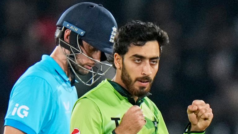 Pakistan's Arafat Minhas, right, celebrates after taking the wicket of England's Jamie Overton 