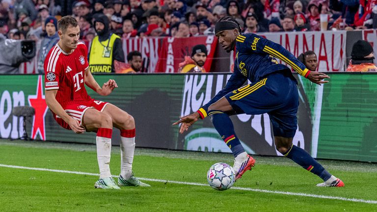 Noni Madueke takes on Josip Stanisic against Bayern Munich