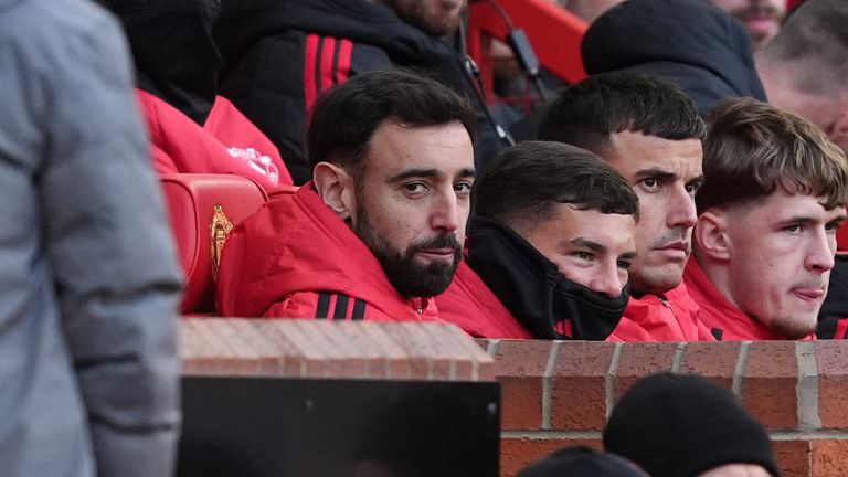 Bruno Fernandes looks on from the substitutes bench at Old Trafford