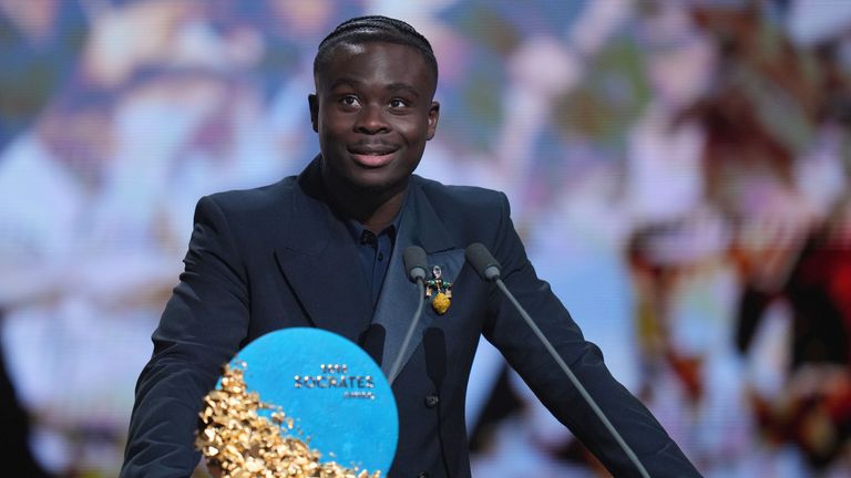 England's Bukayo Saka of Arsenal speaks after winning the Socrates Award, recognising social action and humanitarian work, during the Ballon d'Or ceremony at the London Palladium Theatre in London, England, Monday, Oct. 26, 2026 . (AP Photo/Kin Cheung)
