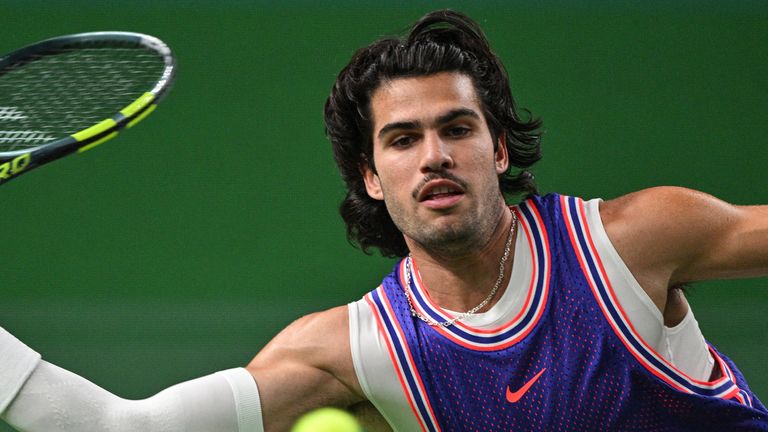 Spain's Carlos Alcaraz hits a return at Shanghai Masters in October 2026 (Getty Images)