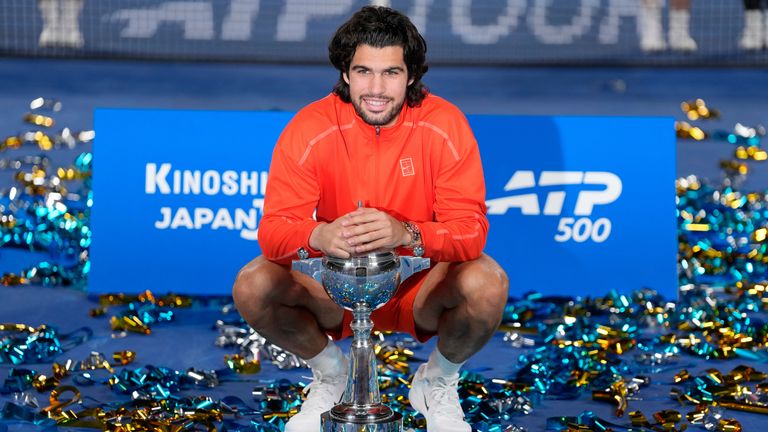 Spain's Carlos Alcaraz poses with the trophy after winning the men's singles final against Czechia's Jiri Lehecka at the Japan Open tennis tournament in Tokyo, Tuesday, Oct. 6, 2026. (AP Photo/Eugene Hoshiko)